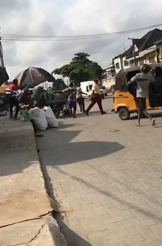 Video Of LASTMA Officials Running Away From Mentally Unstable Man Carrying Stone